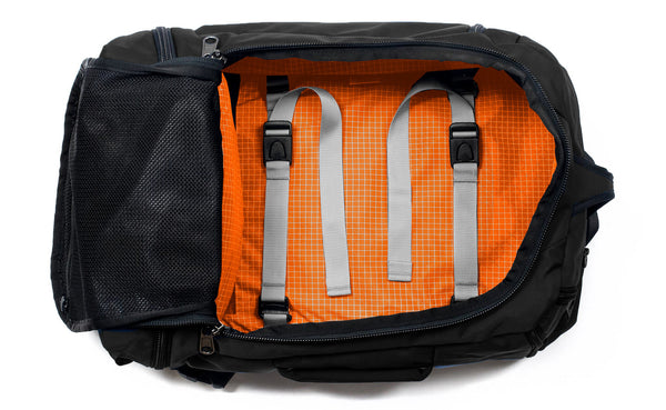 An open Techonaut 30 with a Black exterior and a Zest (orange) interior.